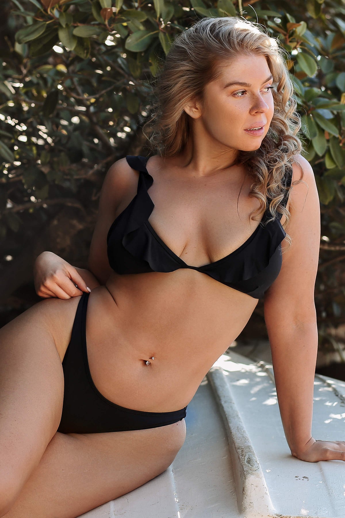 black brazilian bikini with ruffled edges and high hip bottoms